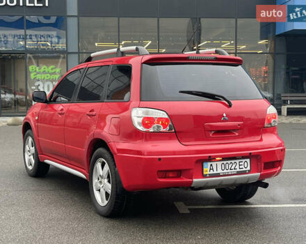 Червоний Міцубісі Аутлендер, об'ємом двигуна 2.4 л та пробігом 308 тис. км за 5990 $, фото 4 на Automoto.ua