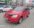 Красный Мицубиси Аутлендер, объемом двигателя 2.4 л и пробегом 269 тыс. км за 5700 $, фото 1 на Automoto.ua