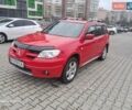 Красный Мицубиси Аутлендер, объемом двигателя 2.4 л и пробегом 269 тыс. км за 5700 $, фото 1 на Automoto.ua