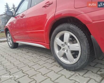 Красный Мицубиси Аутлендер, объемом двигателя 2.4 л и пробегом 269 тыс. км за 5700 $, фото 23 на Automoto.ua