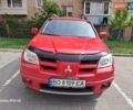 Красный Мицубиси Аутлендер, объемом двигателя 2.4 л и пробегом 265 тыс. км за 5300 $, фото 4 на Automoto.ua