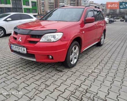 Красный Мицубиси Аутлендер, объемом двигателя 2.4 л и пробегом 269 тыс. км за 5700 $, фото 2 на Automoto.ua