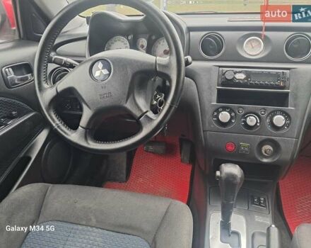 Красный Мицубиси Аутлендер, объемом двигателя 2.4 л и пробегом 269 тыс. км за 5700 $, фото 28 на Automoto.ua