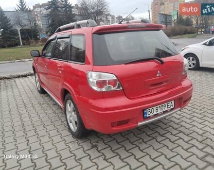Красный Мицубиси Аутлендер, объемом двигателя 2.4 л и пробегом 269 тыс. км за 5700 $, фото 14 на Automoto.ua