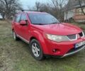 Красный Мицубиси Аутлендер, объемом двигателя 2 л и пробегом 290 тыс. км за 4700 $, фото 1 на Automoto.ua