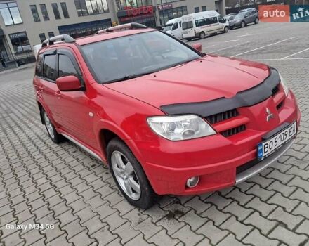 Красный Мицубиси Аутлендер, объемом двигателя 2.4 л и пробегом 269 тыс. км за 5700 $, фото 5 на Automoto.ua