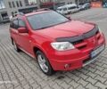 Красный Мицубиси Аутлендер, объемом двигателя 2.4 л и пробегом 269 тыс. км за 5700 $, фото 5 на Automoto.ua