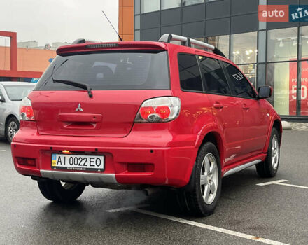 Червоний Міцубісі Аутлендер, об'ємом двигуна 2.4 л та пробігом 308 тис. км за 5990 $, фото 5 на Automoto.ua