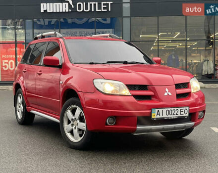Червоний Міцубісі Аутлендер, об'ємом двигуна 2.4 л та пробігом 308 тис. км за 5990 $, фото 1 на Automoto.ua