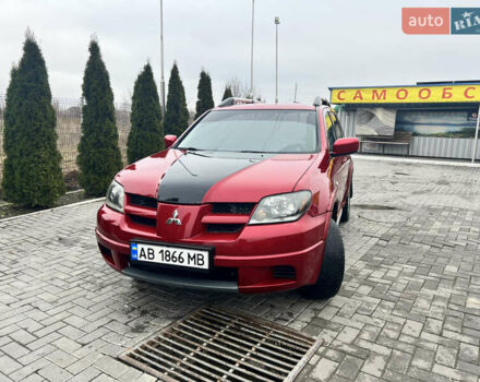 Червоний Міцубісі Аутлендер, об'ємом двигуна 2.4 л та пробігом 187 тис. км за 5600 $, фото 5 на Automoto.ua