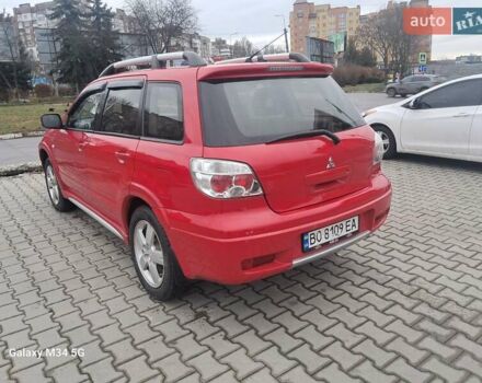 Красный Мицубиси Аутлендер, объемом двигателя 2.4 л и пробегом 269 тыс. км за 5700 $, фото 12 на Automoto.ua