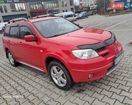 Красный Мицубиси Аутлендер, объемом двигателя 2.4 л и пробегом 269 тыс. км за 5700 $, фото 4 на Automoto.ua