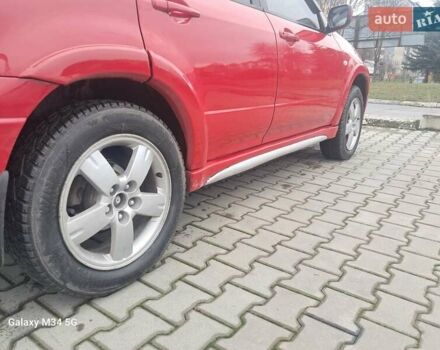 Красный Мицубиси Аутлендер, объемом двигателя 2.4 л и пробегом 269 тыс. км за 5700 $, фото 24 на Automoto.ua