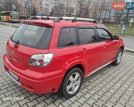 Красный Мицубиси Аутлендер, объемом двигателя 2.4 л и пробегом 269 тыс. км за 5700 $, фото 9 на Automoto.ua