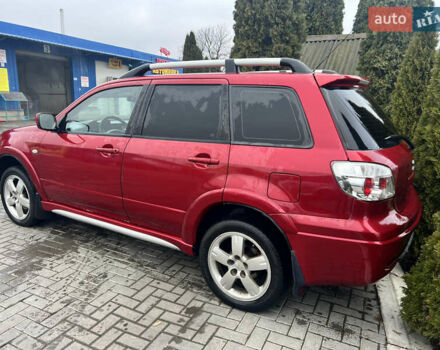 Червоний Міцубісі Аутлендер, об'ємом двигуна 2.4 л та пробігом 187 тис. км за 5600 $, фото 1 на Automoto.ua