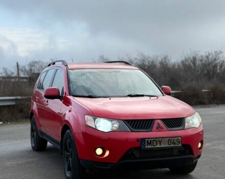 Красный Мицубиси Аутлендер, объемом двигателя 2 л и пробегом 290 тыс. км за 5200 $, фото 1 на Automoto.ua