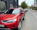 Красный Мицубиси Аутлендер, объемом двигателя 2.4 л и пробегом 137 тыс. км за 7700 $, фото 1 на Automoto.ua