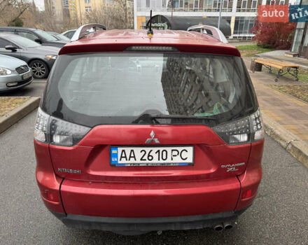 Красный Мицубиси Аутлендер, объемом двигателя 3 л и пробегом 204 тыс. км за 8200 $, фото 2 на Automoto.ua