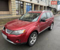 Красный Мицубиси Аутлендер, объемом двигателя 3 л и пробегом 204 тыс. км за 8200 $, фото 1 на Automoto.ua