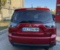 Красный Мицубиси Аутлендер, объемом двигателя 2.36 л и пробегом 143 тыс. км за 8500 $, фото 4 на Automoto.ua