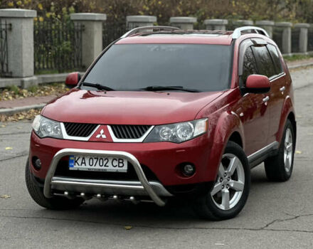 Красный Мицубиси Аутлендер, объемом двигателя 2.4 л и пробегом 180 тыс. км за 8900 $, фото 1 на Automoto.ua