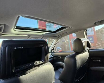 Красный Мицубиси Аутлендер, объемом двигателя 2.36 л и пробегом 143 тыс. км за 8500 $, фото 13 на Automoto.ua