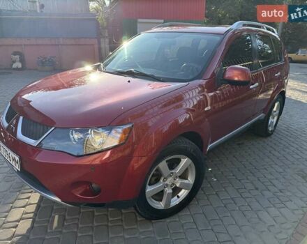 Красный Мицубиси Аутлендер, объемом двигателя 2.36 л и пробегом 143 тыс. км за 8500 $, фото 1 на Automoto.ua