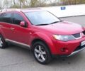 Красный Мицубиси Аутлендер, объемом двигателя 3 л и пробегом 260 тыс. км за 9000 $, фото 1 на Automoto.ua