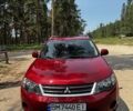 Красный Мицубиси Аутлендер, объемом двигателя 3 л и пробегом 214 тыс. км за 9200 $, фото 1 на Automoto.ua