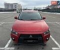 Красный Мицубиси Аутлендер, объемом двигателя 2.4 л и пробегом 193 тыс. км за 10450 $, фото 1 на Automoto.ua