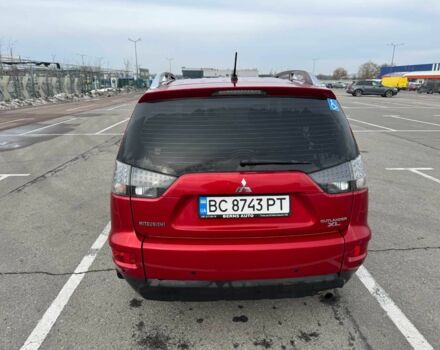 Красный Мицубиси Аутлендер, объемом двигателя 2.4 л и пробегом 201 тыс. км за 9750 $, фото 1 на Automoto.ua