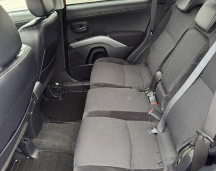 Красный Мицубиси Аутлендер, объемом двигателя 2 л и пробегом 204 тыс. км за 10350 $, фото 29 на Automoto.ua