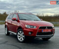 Красный Мицубиси Аутлендер, объемом двигателя 2 л и пробегом 204 тыс. км за 10350 $, фото 1 на Automoto.ua