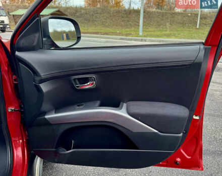 Красный Мицубиси Аутлендер, объемом двигателя 2 л и пробегом 204 тыс. км за 10350 $, фото 34 на Automoto.ua