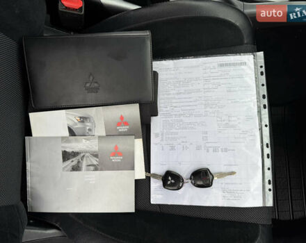 Красный Мицубиси Аутлендер, объемом двигателя 2 л и пробегом 204 тыс. км за 10350 $, фото 40 на Automoto.ua