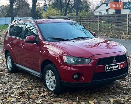 Красный Мицубиси Аутлендер, объемом двигателя 2.4 л и пробегом 251 тыс. км за 8990 $, фото 2 на Automoto.ua