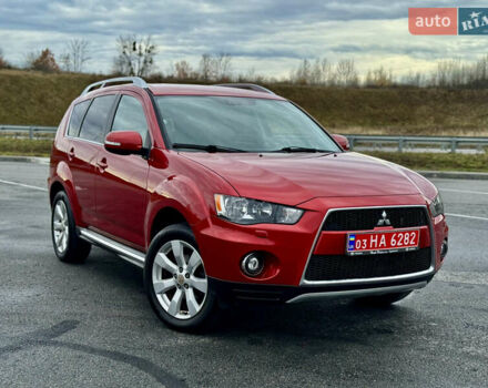 Красный Мицубиси Аутлендер, объемом двигателя 2 л и пробегом 204 тыс. км за 10350 $, фото 1 на Automoto.ua
