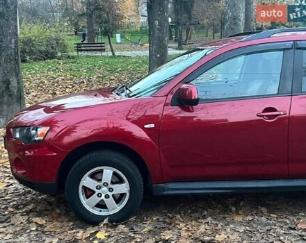 Красный Мицубиси Аутлендер, объемом двигателя 2.4 л и пробегом 251 тыс. км за 8990 $, фото 4 на Automoto.ua