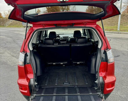 Красный Мицубиси Аутлендер, объемом двигателя 2 л и пробегом 204 тыс. км за 10350 $, фото 37 на Automoto.ua