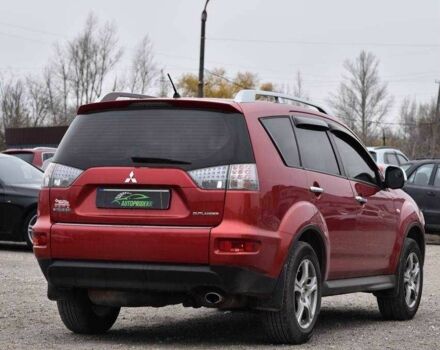 Красный Мицубиси Аутлендер, объемом двигателя 2.4 л и пробегом 204 тыс. км за 9499 $, фото 1 на Automoto.ua