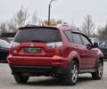 Красный Мицубиси Аутлендер, объемом двигателя 2.4 л и пробегом 204 тыс. км за 9499 $, фото 1 на Automoto.ua