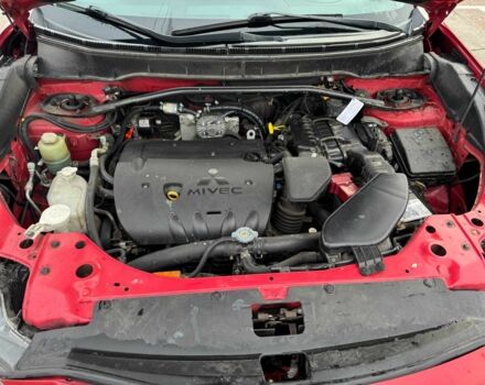 Красный Мицубиси Аутлендер, объемом двигателя 2.4 л и пробегом 201 тыс. км за 9750 $, фото 4 на Automoto.ua