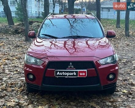 Красный Мицубиси Аутлендер, объемом двигателя 2.4 л и пробегом 251 тыс. км за 8990 $, фото 1 на Automoto.ua