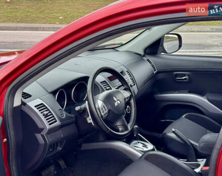 Красный Мицубиси Аутлендер, объемом двигателя 2 л и пробегом 204 тыс. км за 10350 $, фото 17 на Automoto.ua