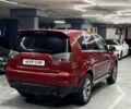 Красный Мицубиси Аутлендер, объемом двигателя 3 л и пробегом 210 тыс. км за 9500 $, фото 3 на Automoto.ua