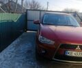 Красный Мицубиси Аутлендер, объемом двигателя 2.18 л и пробегом 201 тыс. км за 12900 $, фото 1 на Automoto.ua