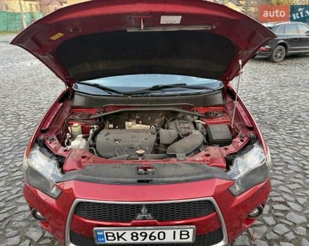 Красный Мицубиси Аутлендер, объемом двигателя 2.36 л и пробегом 134 тыс. км за 10600 $, фото 17 на Automoto.ua