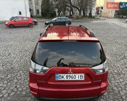 Красный Мицубиси Аутлендер, объемом двигателя 2.36 л и пробегом 134 тыс. км за 10600 $, фото 4 на Automoto.ua