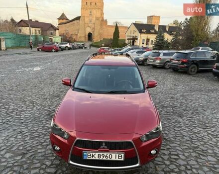 Красный Мицубиси Аутлендер, объемом двигателя 2.36 л и пробегом 134 тыс. км за 10600 $, фото 5 на Automoto.ua