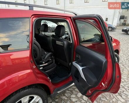 Красный Мицубиси Аутлендер, объемом двигателя 2.36 л и пробегом 134 тыс. км за 10600 $, фото 8 на Automoto.ua